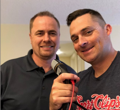 Jeff Burroughs and Chad Jordan Holding Podcast Microphone